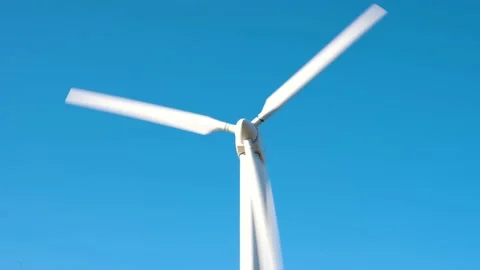 Close up of wind turbine spining at full speed generating renewable energy Stock Footage 150318238