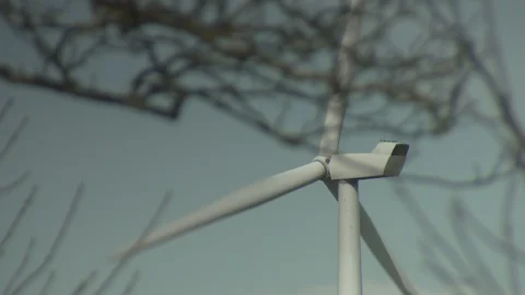Close Up Of Wind Turbine Through Tree Branches. Stock-Footage 107387719