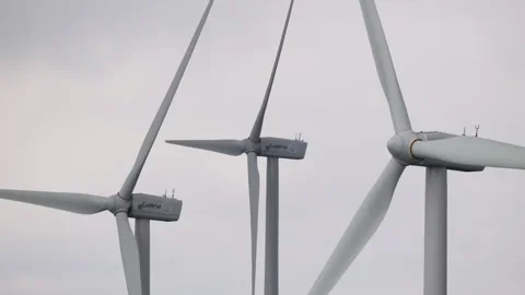 Close-Up of Wind Turbines Against Overcast Skies on Vermio Mountain Stock Footage 333627396