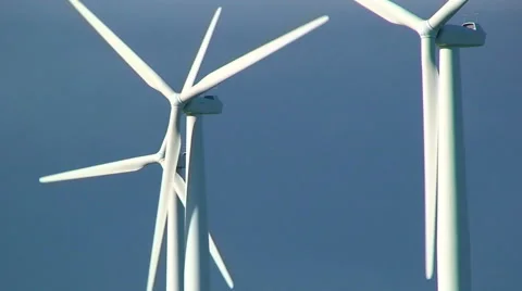 Close up on windmill turbines in front of dark clouds Stock Footage 39994185