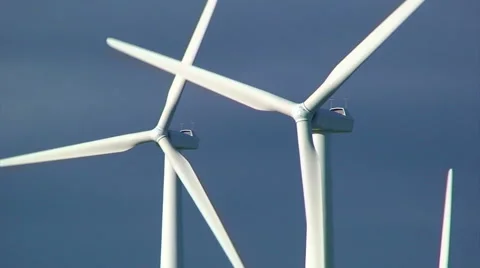 Close up on windmill turbines in front of dark clouds Stock Footage 39994205