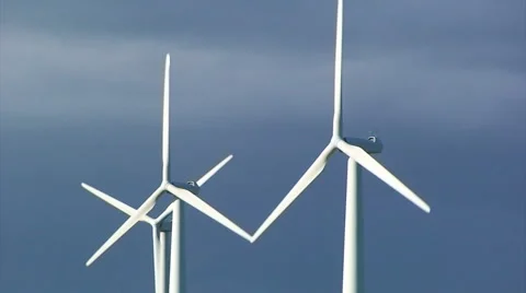Close up on windmill turbines in front of dark clouds Stock Footage 39996541