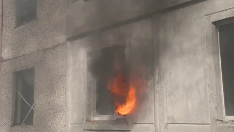 Close up of window of an apartment building from which smoke comes out. A house Video stock 148108881