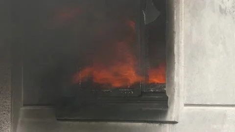 Close up of window of an apartment building from which smoke comes out. A house  Video stock 148290157