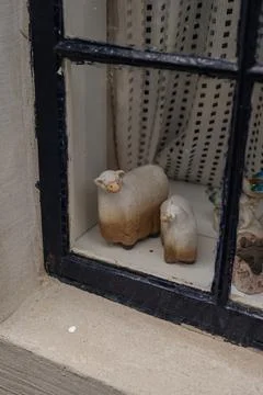 Close Up of Window with Ceramic Sheep Figurines in Norway Stock Photos