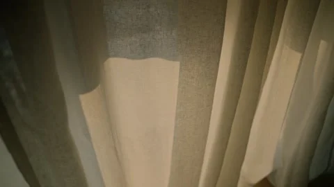 Close up on window curtain as a blackout screen slowly closing until room is Video stock 345027744