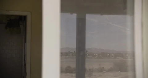Close Up of Window Focus on Desert Reflections Tilt Down Stock Footage 89942119