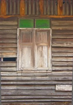 Close window of the old broken house Stock Photos