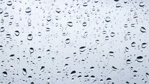 Close-up of a window pane with raindrops Video stock 232685524