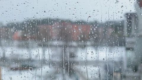 Close up of a window with rain drops falling down. Stock Footage 180419241