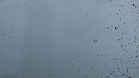 Close up of a window with rain drops falling down. Stock Footage 180419999