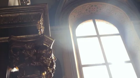 A close-up of a window in the temple, through which the sun breaks Stock Footage 88859270