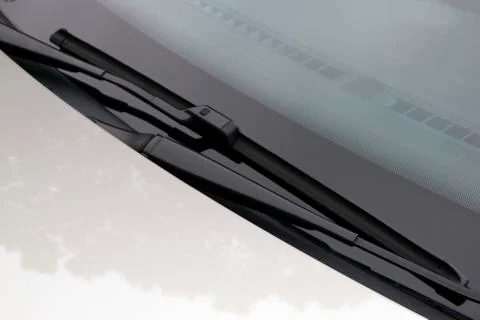 Close up of windscreen wipers in resting position on windshield Stock Photos