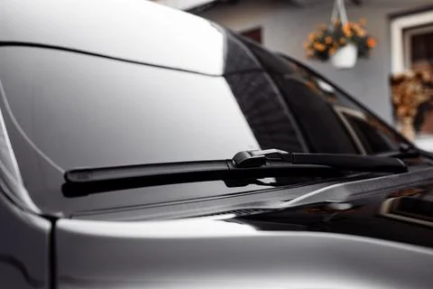 Close up of the windshield and wipers of a modern car. Automotive industry. C Stock Photos