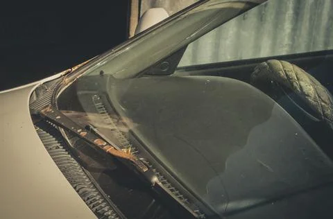Close-up of the windshield and wipers of an old car. Dust, rust and dirt on Stock Photos