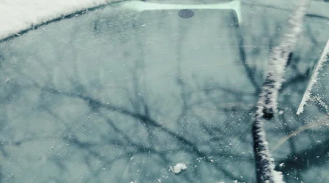 Close-up of windshield wipers brushing away the snow Stock Footage 37449510