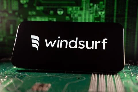 Close up of Windsurf logo on smartphone screen with motherboard background. Stock Photos