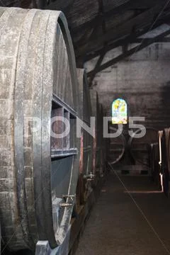 Close up of wine barrels in cellar Stock Photos