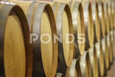 Close up of wine barrels in cellar Stock Photos