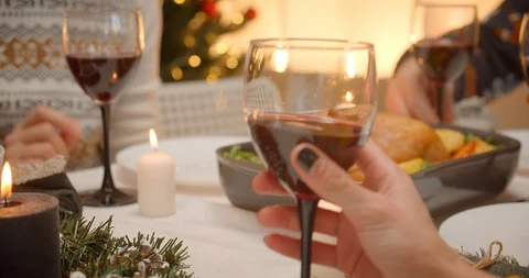 Close-up wine clink glasses dinner family evening christmas Stock Footage 122624807