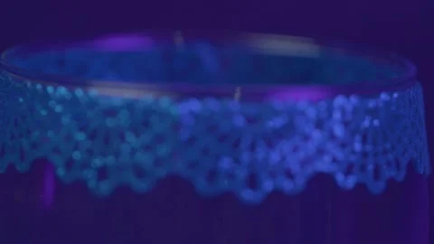 Close-Up of Wine Glass with Delicate Rim Under Subtle Lighting 스톡 동영상 325834331