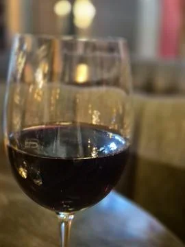 Close Up of a Wine Glass on a Table Stock Photos