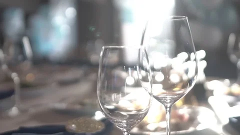 Close-up of wine glasses on a table. served table before the holiday. Stock Footage 123540948