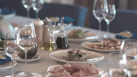 Close-up of wine glasses on a table. snacks prepared. waiting for guests. Video stock 123541161