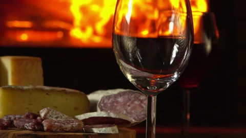 Close-up of wine poured into the glass on the background of the fireplace Stock Footage 136694670