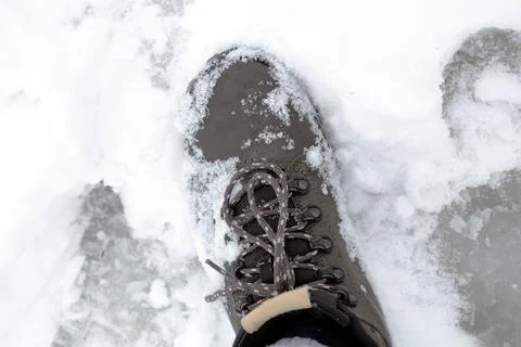 Close-up of winter boots in the snow. Stock Photos