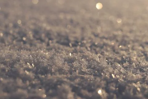 Close-up of winter cover with a noticeable structure of snowflakes. Winter .. Stock Photos