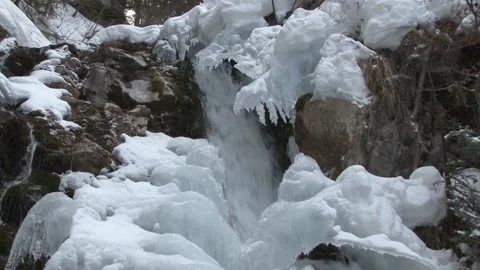 Close Up of Winter waterfall flowing in slow motion - SLOMO Stock Footage 143013844