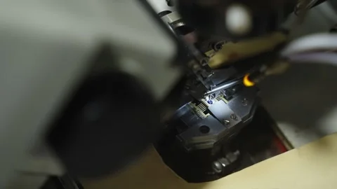 Close-up of wire bonding on a microchip under a microscope, with bonding tool Stock Footage 325976853