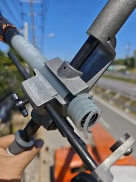 Close up of wire stripping tool removing insulation from high voltage. Stock Photos