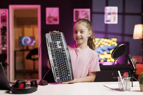 Close up on wireless Bluetooth mechanical keyboard hold by young internet star Stock Photos