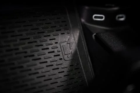 Close Up of Wireless Charging Pad with USB C Ports in Luxury Car Stock Photos