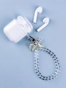 Close up wireless earphone case in cute bear case Stock Photos