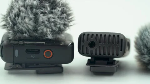 Close up of wireless microphone with furry windscreen on white background Stock Footage 331694278