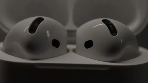 Close-up of wireless white headphones with a case Stock Footage 318542072