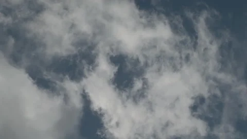Close-up of wispy clouds against a deep blue sky. 4K 60fps. Stock Footage 334039828
