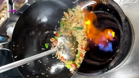 Close up of a wok in slow motion Stock Footage 231552129