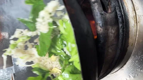 Close up of a wok in slow motion Stock Footage 231552135