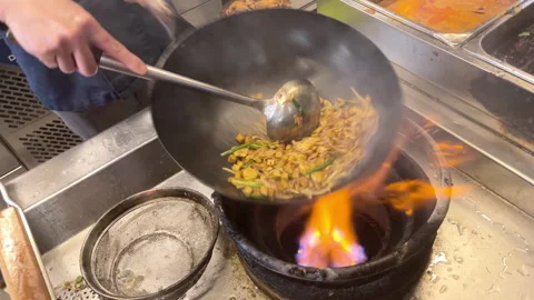 Close up of a wok in slow motion Stock Footage 234926780