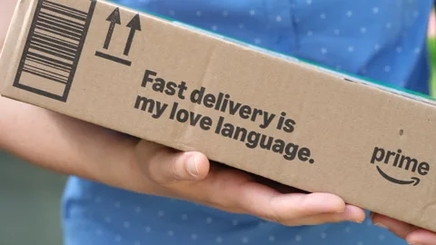 Close-up of a woman with Amazon Prime box Stock Footage 310044290