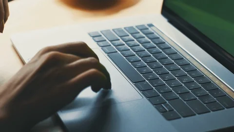 Close-up of woman arms using touchpad on laptop with green screen Stock Footage 117128309