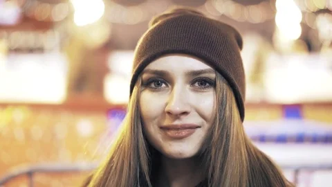 Close up of a woman in a beanie looking at camera Stock Footage