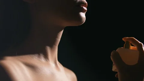 Close up of woman with bottle of perfume Stock Footage 105034553