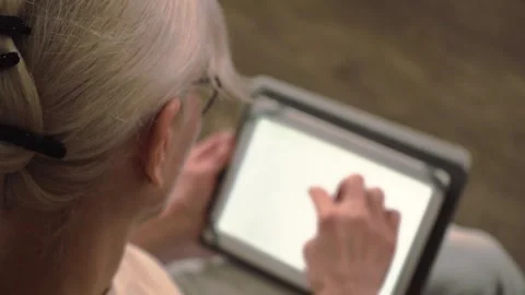 Close-up of a woman browsing on a tablet Stock Footage 304810349