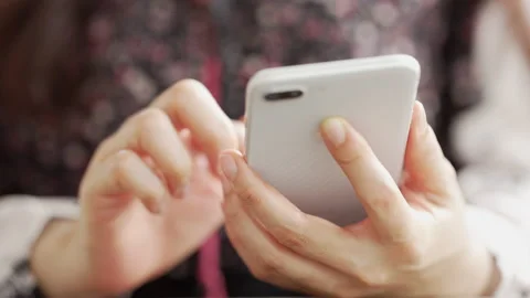 Close up Woman checking email with mobile phone at a coffee shop Stock Footage 152609862