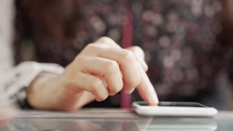 Close up Woman checking email with mobile phone at a coffee shop Stock Footage 152610173